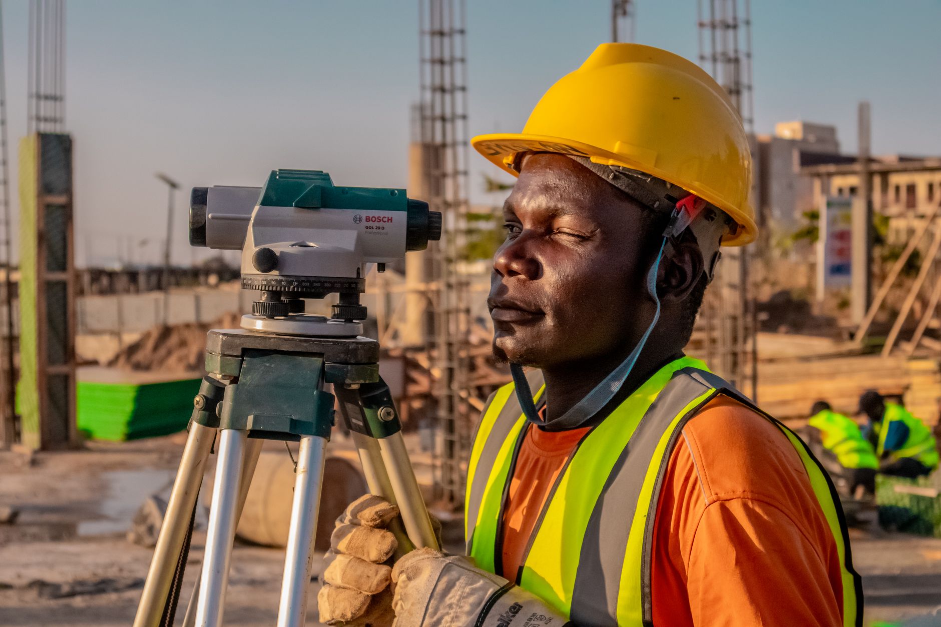Survey Plan - construction worker using survey equipment outdoors
