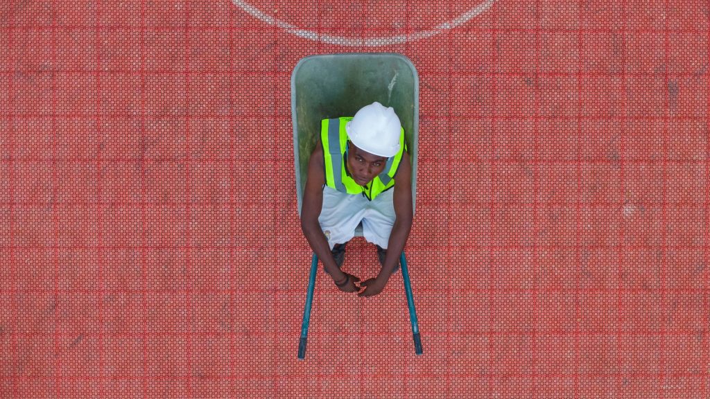 aerial view of construction worker in wheelbarrow